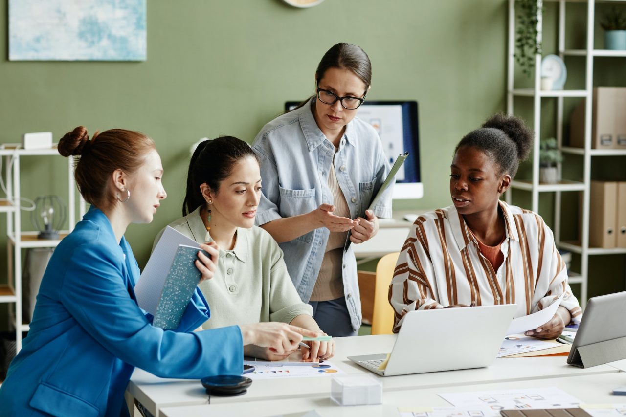 business-team-using-laptop-at-meeting.jpg